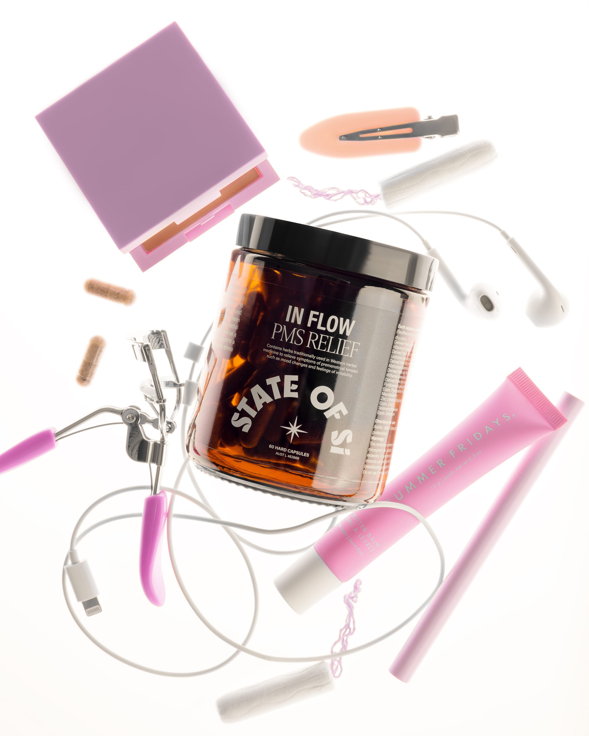 Product packaging labeled 'In Flow PMS Relief' surrounded by various items on a white background